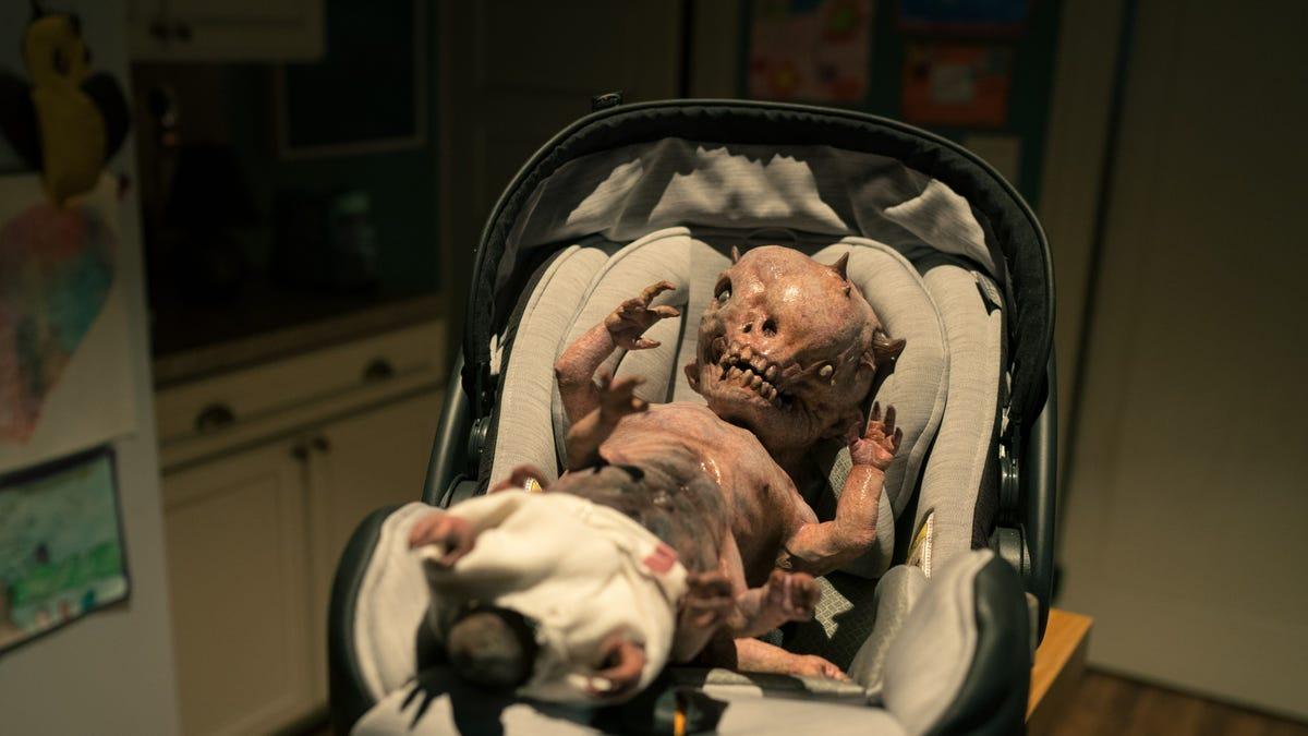 Demon baby in a car seat.