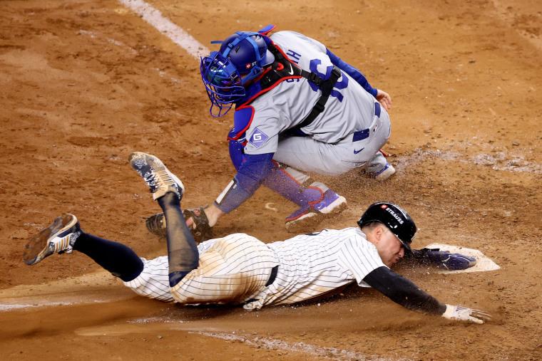 Anthony Volpe slides into home plate