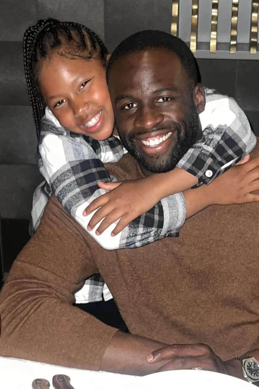 Draymond Green com sua filha Olive Green