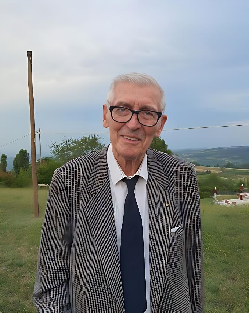 Retrato de Francesco Rivella, inventor do Nutella, vestindo um terno e gravata.