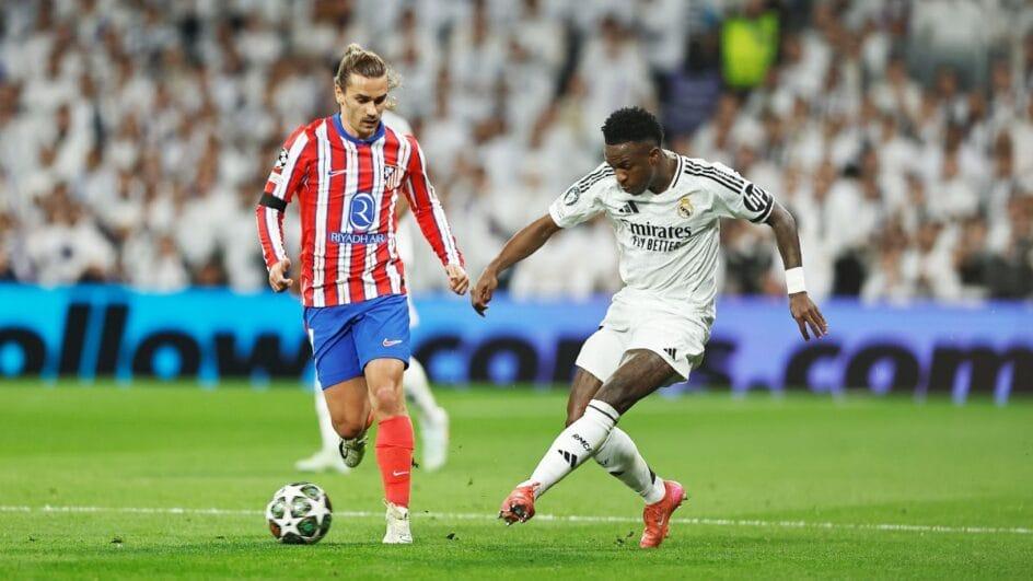 Griezmann e Vini Júnior durante o jogo entre Atlético de Madrid e Real Madrid
