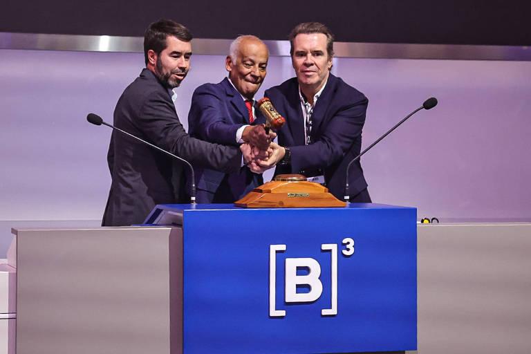 Executivos da Comporte durante o leilão