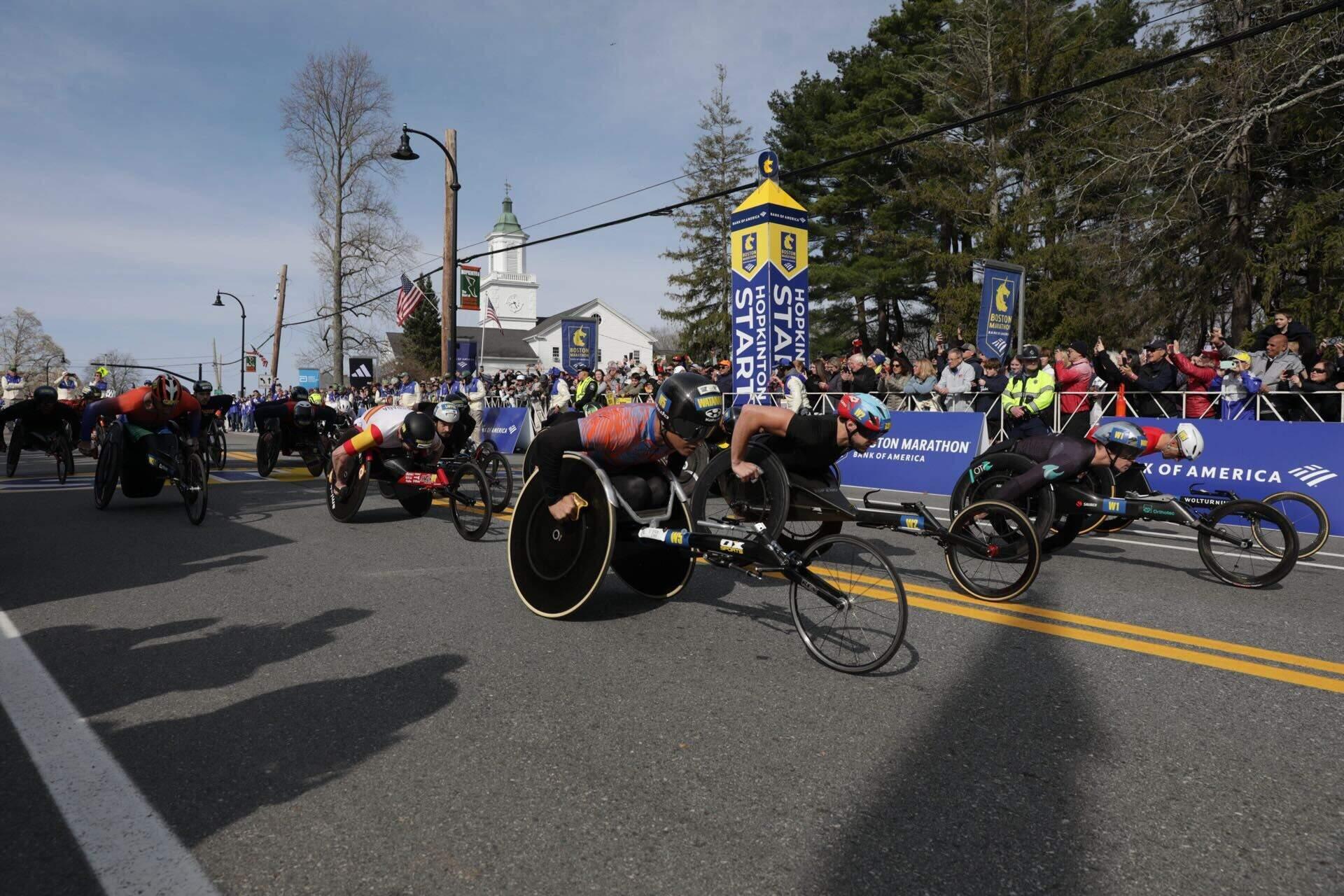 Wheelchair racers take off from Hopkinton on Monday. (Robin Lubbock/WBUR)