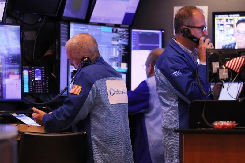 Traders work on the floor of the New York Stock Exchange