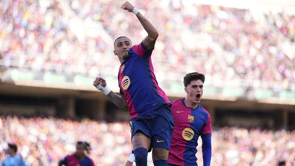 Raphinha celebrates.