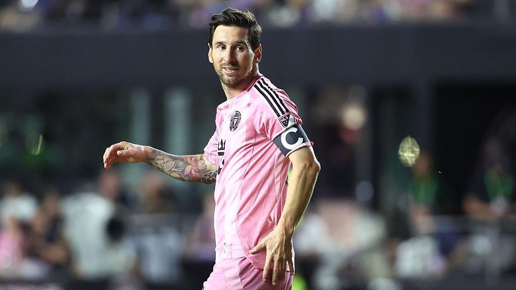 Lionel Messi looks on