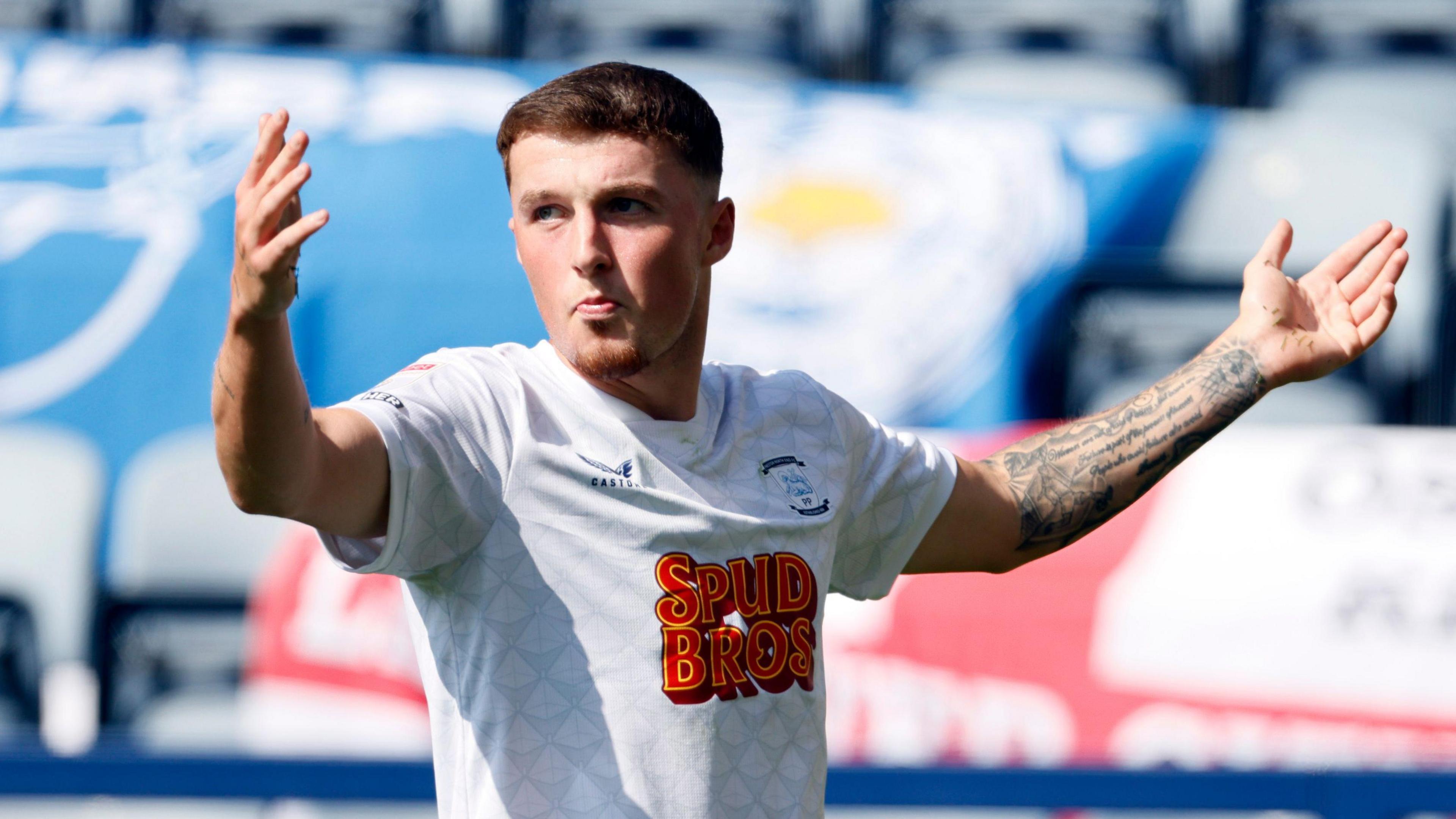 Alfie Devine celebrates his goal for Preston