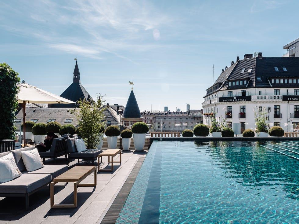 Rooftop swimming pool overlooking city buildings