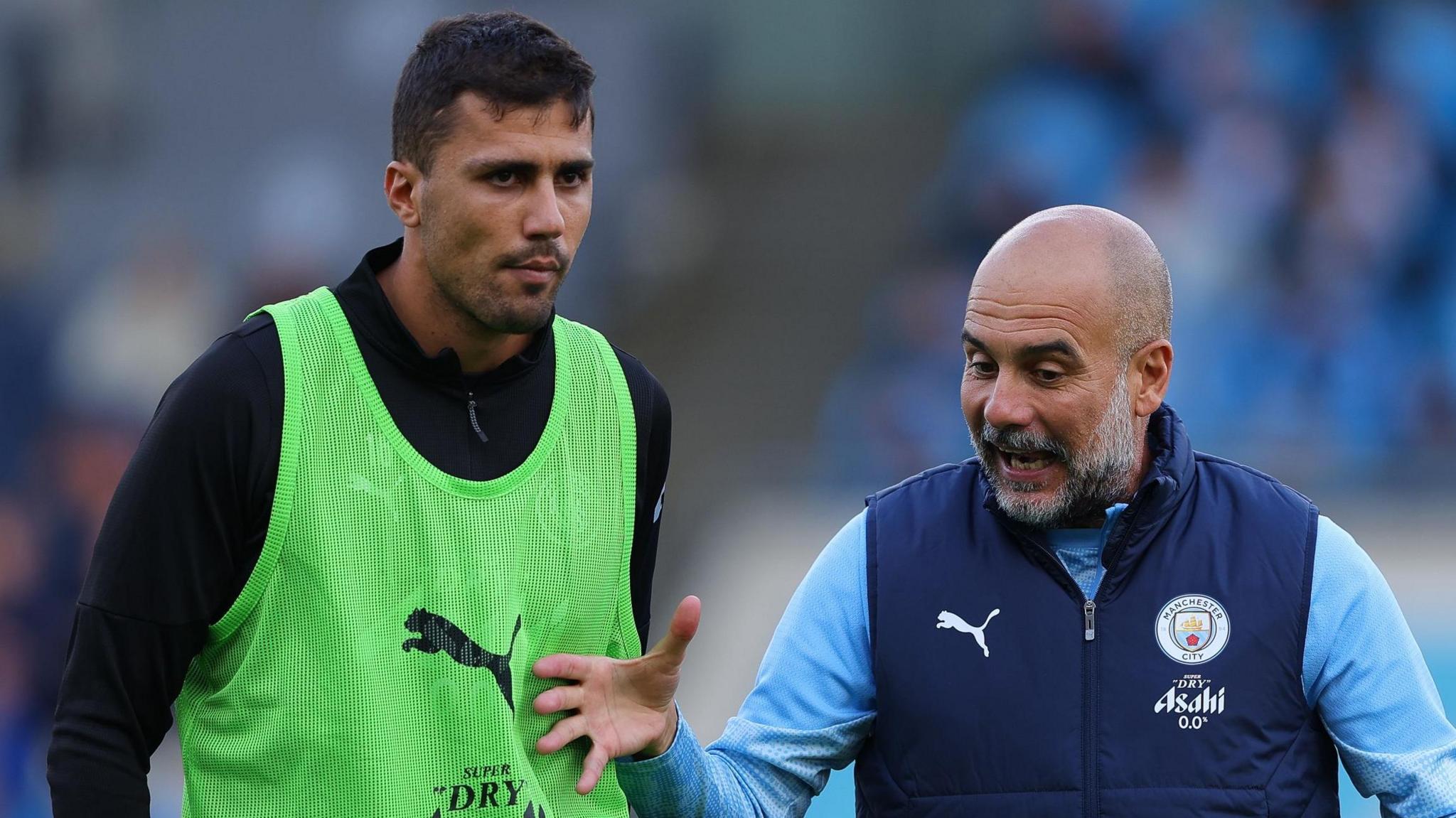 Rodri e Pep Guardiola