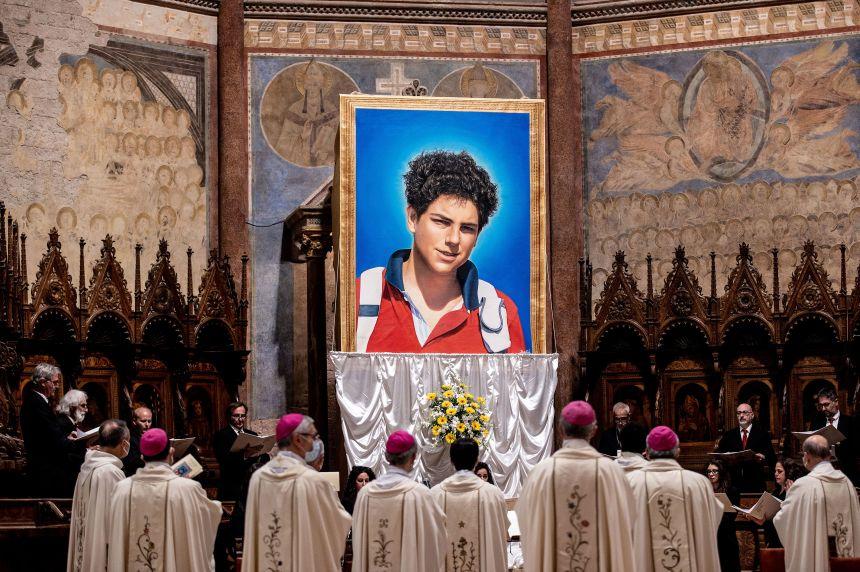 A tapestry of Carlo Acutis is unveiled at St. Francis Basilica during the beatification ceremony of Acutis on October 10, 2020, in Assisi, Italy.