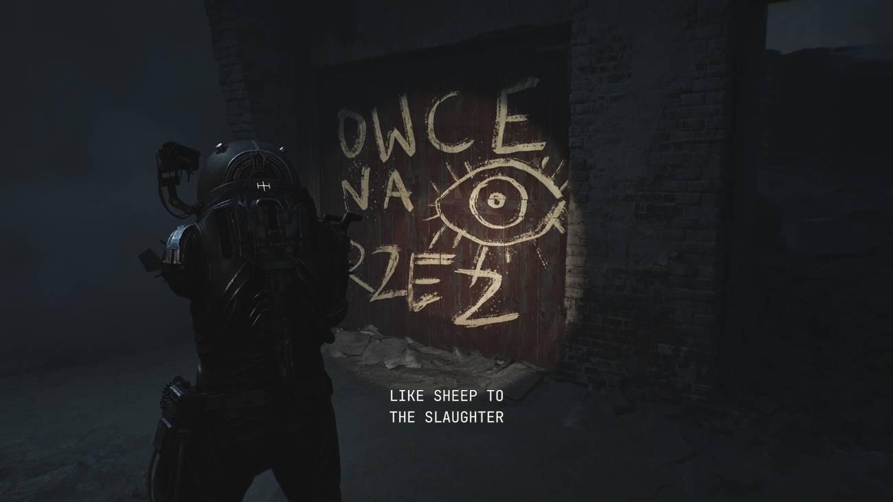 The Traveler analisa grafite que diz: 'COMO OVELHAS PARA O ABATE'.