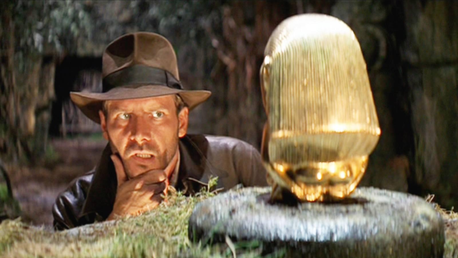Indiana Jones contemplates the idol from Raiders of the Lost Ark