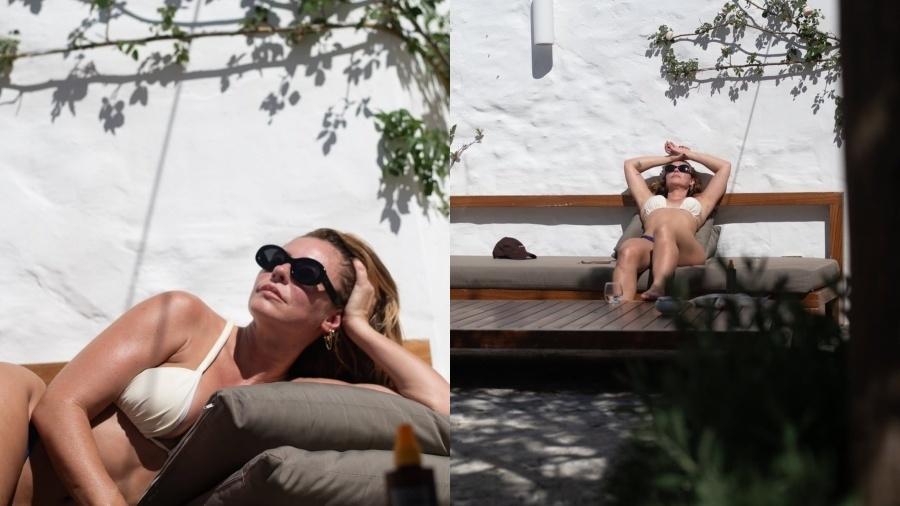 Paolla Oliveira bronzeando-se em clima descontraído durante a viagem