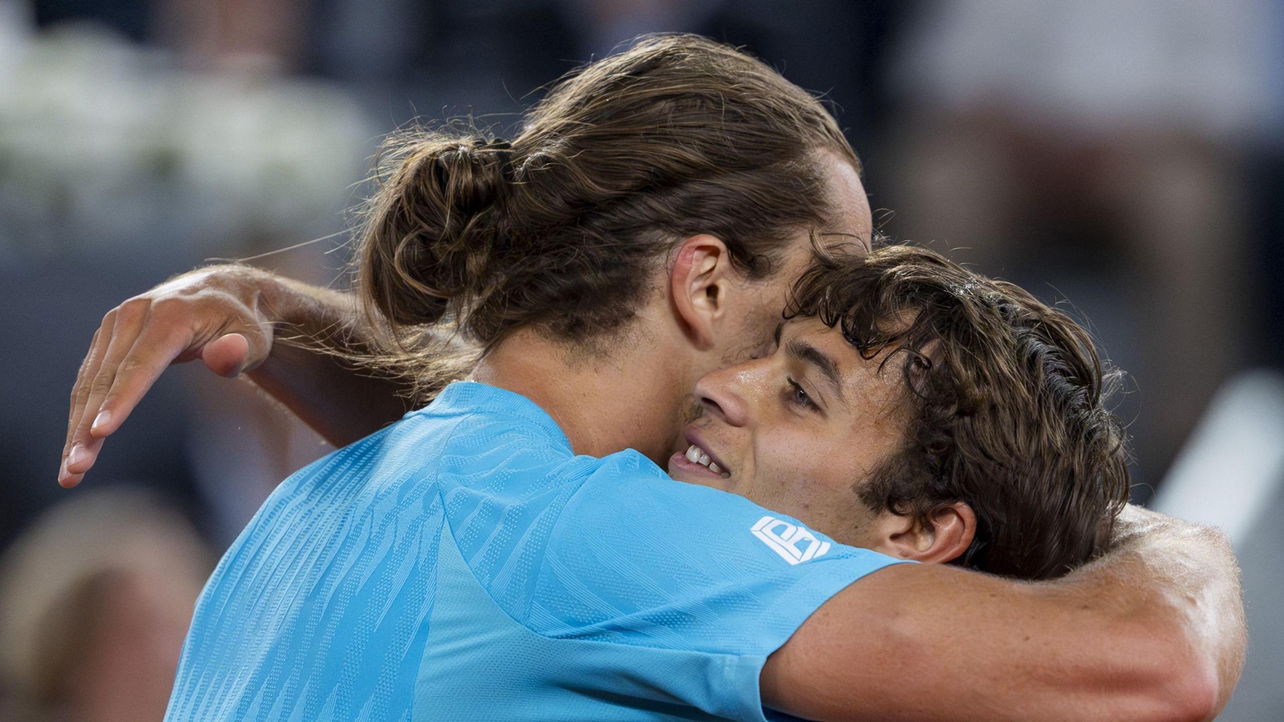 Alexander Zverev hugs Flavio Cobolli after their match at the 2026 Madrid Open.