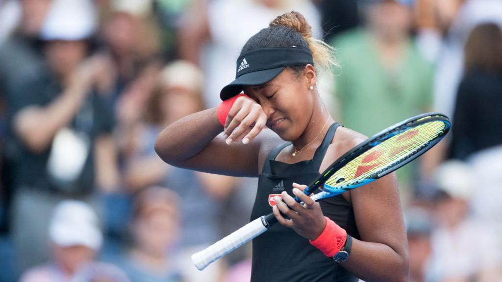 Naomi Osaka reacts to her win against Aryna Sabalenka